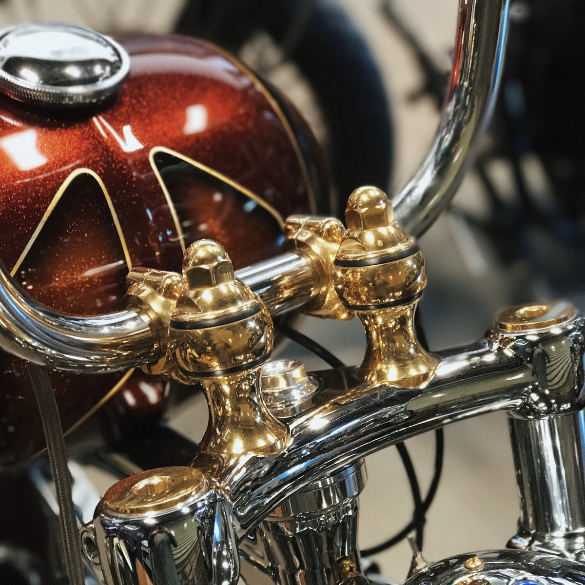 Indian Larry, Throwback Risers. 2" rise. Polished brass