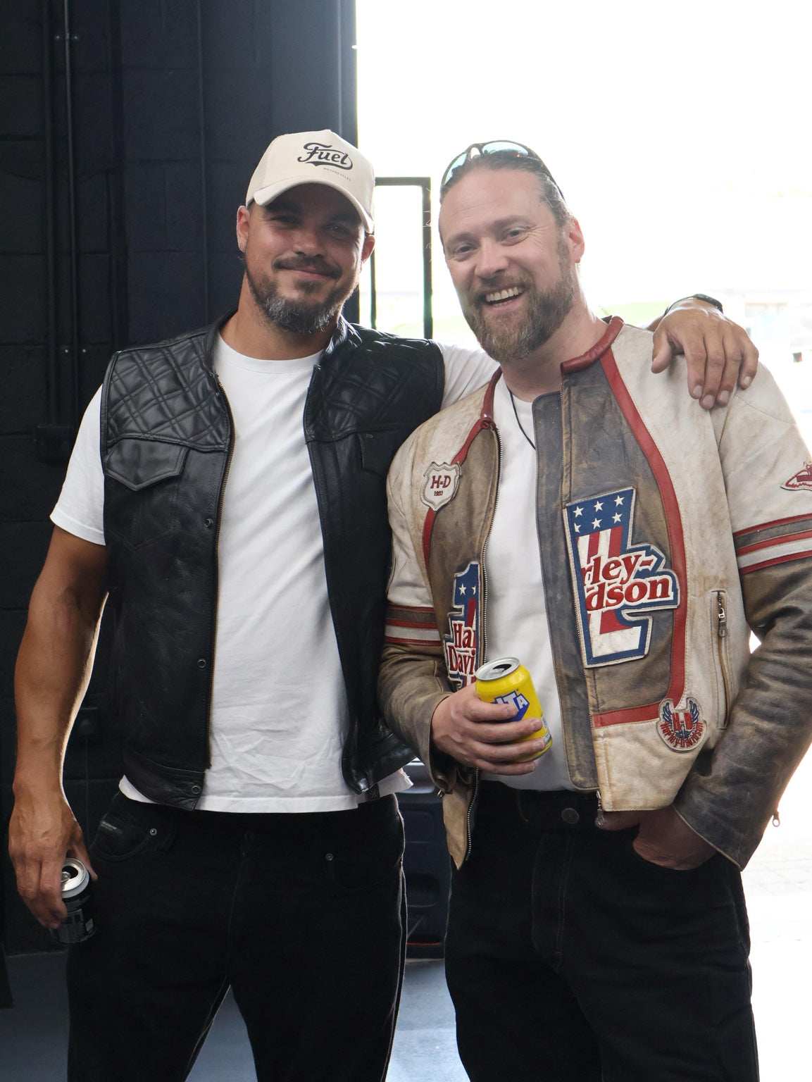 Two riders smiling together at the event.