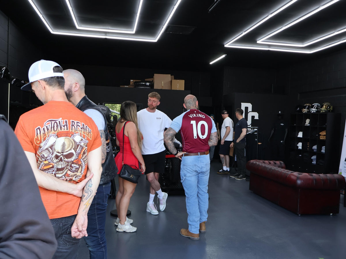 Guests socialising inside the Deathproof Cycles shop at its opening party.