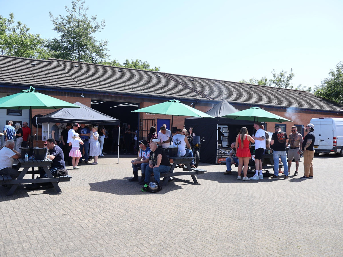 Guests gathered outside Deathproof Cycles for the shop opening party.