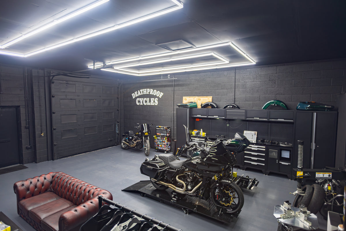 Motorcycles on lifts inside the Deathproof Cycles workshop in Rugeley